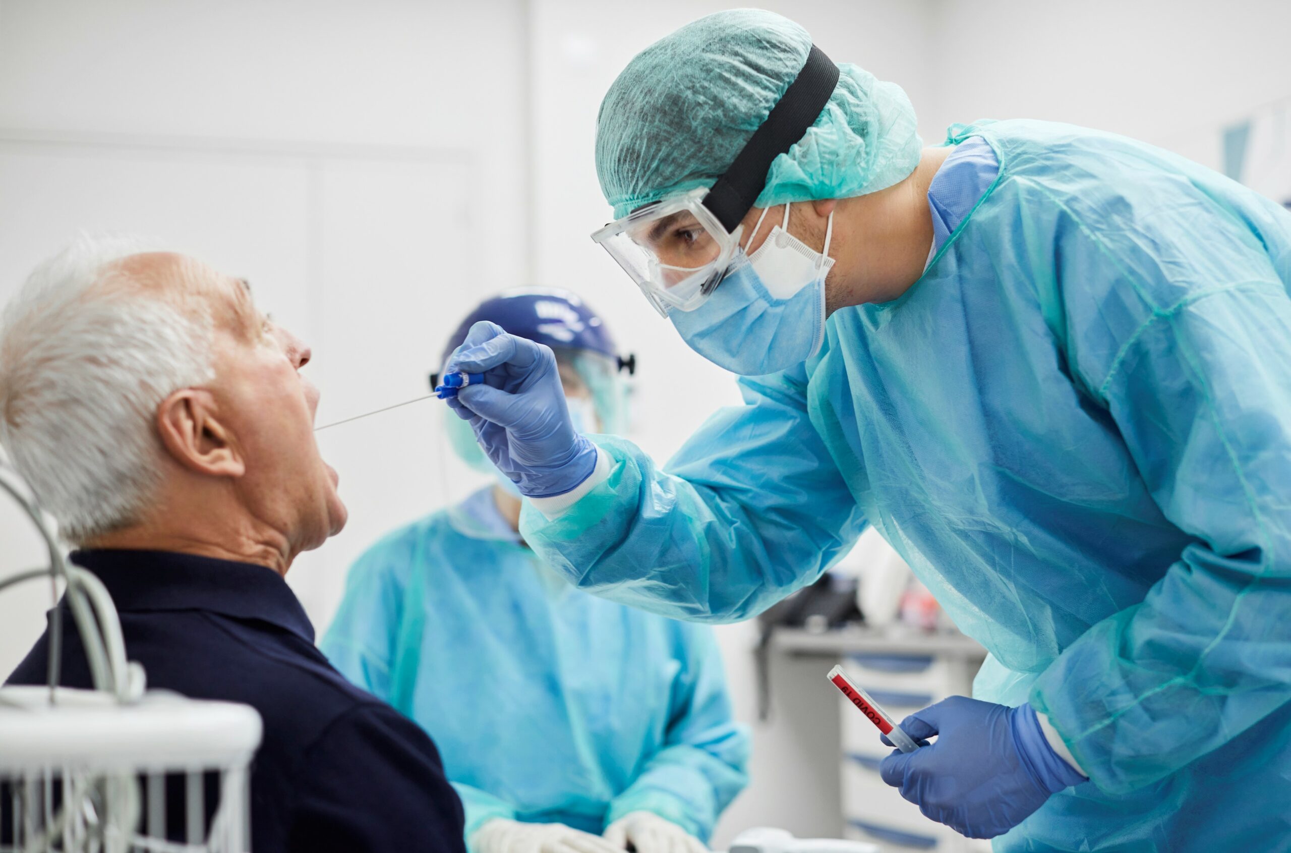 Doctor Taking Throat Swab Test From Male Patient, PCR